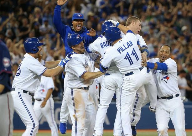 Munenori Kawasaki and Jose Bautista of the Toronto Blue Jays stretch  News Photo - Getty Images